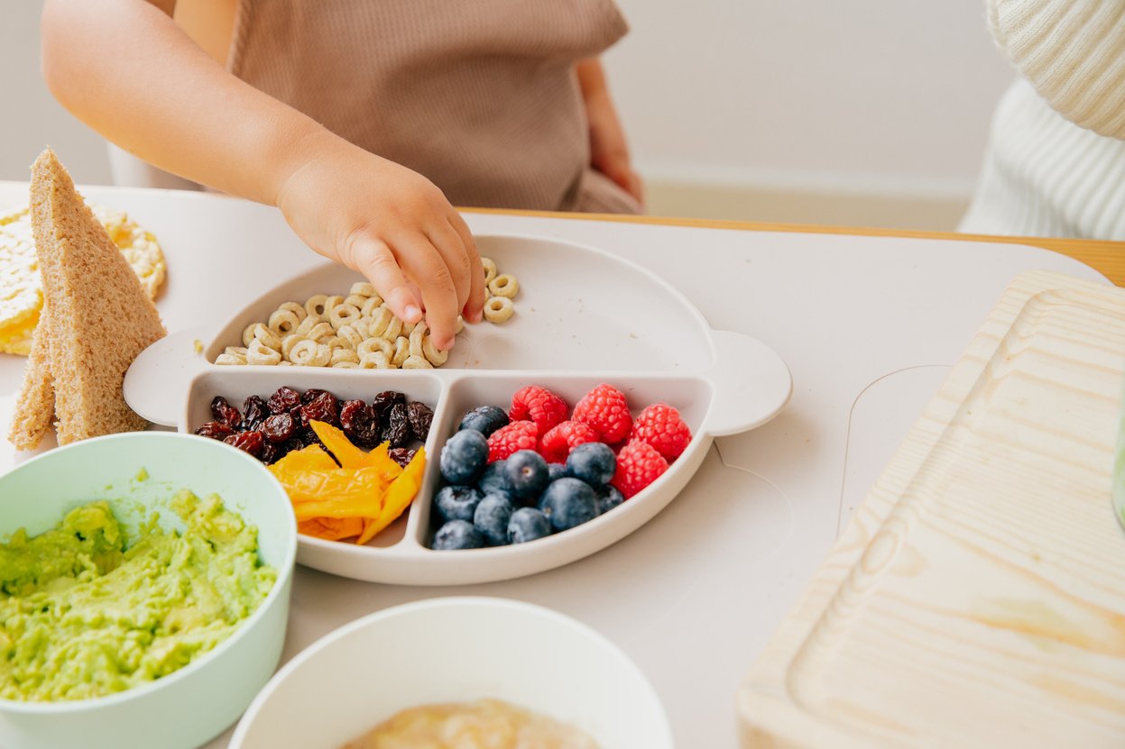 Baby Picking Food from a Plate